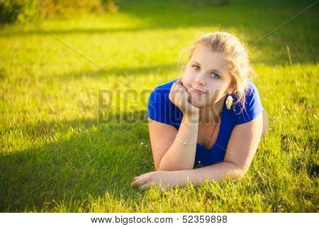 Girl Lying In Grass During Sunny Day