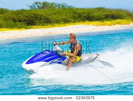 Young Man on Jet Ski, Tropical Ocean, Vacation Concept