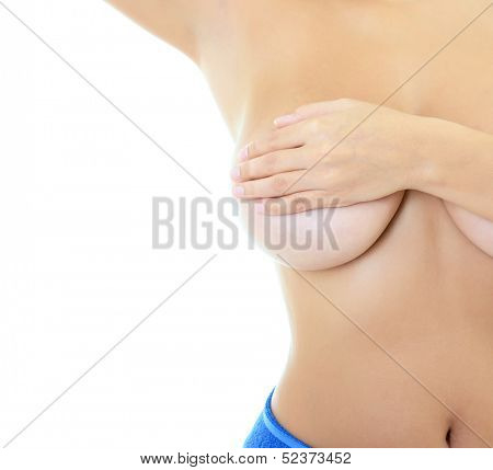Body of beautiful woman covering her breast and showing armpit, over white