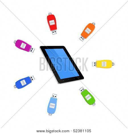 Colorful flashdrives around tablet PC.
