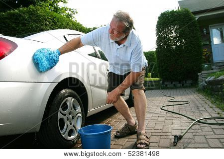 Man washing the silver car