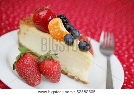 Cheesecake with fruits and fork