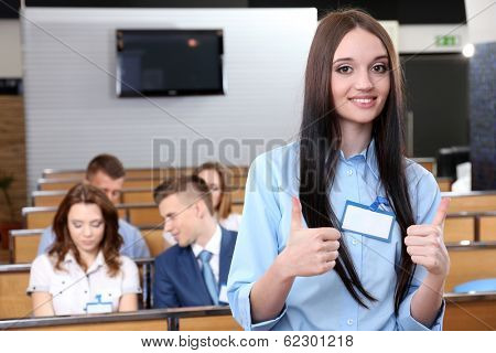 Businesswoman delivering presentation at conference