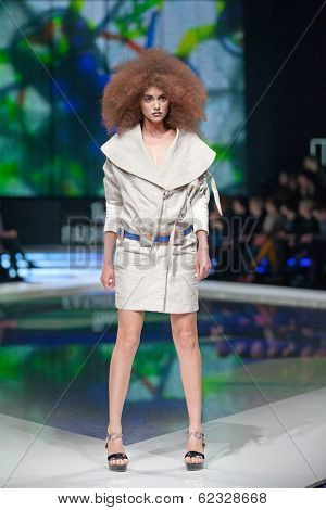 ZAGREB, CROATIA - MARCH 28, 2014: Fashion model wearing clothes designed by Marina Design and Marija Ivanovic belt on the 'Fashion.hr' fashion show