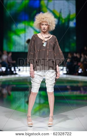 ZAGREB, CROATIA - MARCH 28, 2014: Fashion model wearing clothes designed by Marina Design and Marija Ivanovic jewelry on the 'Fashion.hr' fashion show