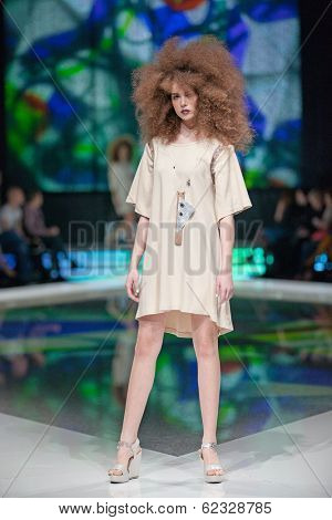 ZAGREB, CROATIA - MARCH 28, 2014: Fashion model wearing clothes designed by Marina Design and Marija Ivanovic jewelry on the 'Fashion.hr' fashion show