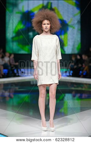 ZAGREB, CROATIA - MARCH 28, 2014: Fashion model wearing clothes designed by Marina Design and Marija Ivanovic jewelry on the 'Fashion.hr' fashion show