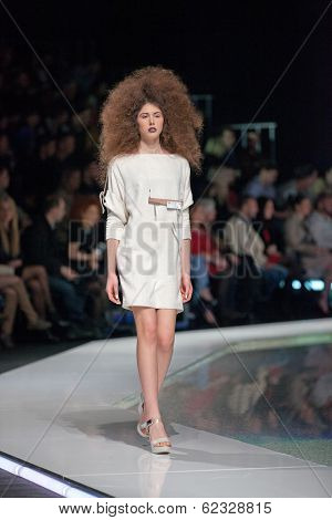 ZAGREB, CROATIA - MARCH 28, 2014: Fashion model wearing clothes designed by Marina Design and Marija Ivanovic jewelry on the 'Fashion.hr' fashion show