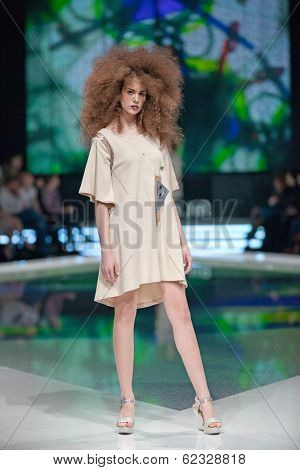 ZAGREB, CROATIA - MARCH 28, 2014: Fashion model wearing clothes designed by Marina Design and Marija Ivanovic jewelry on the 'Fashion.hr' fashion show