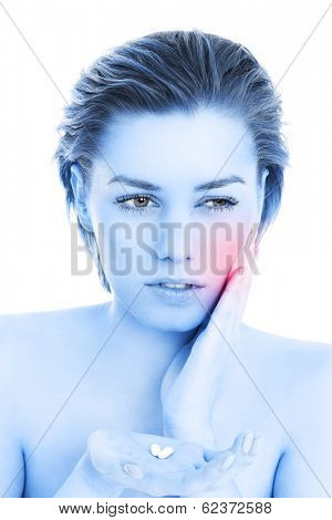 Picture of a woman holding pills over white background