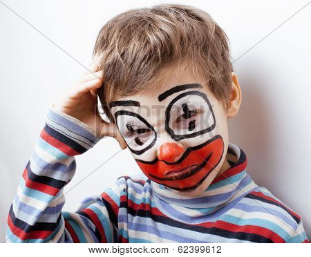 little cute boy with facepaint like clown, pantomimic expressions close up