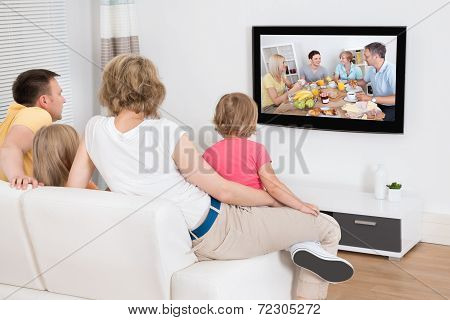 Young Family Watching Tv Together