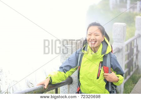 woman hiker on peak of emei mountain