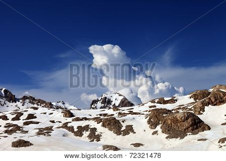 Snowy Rocks And Sky With Clouds At Nice Day