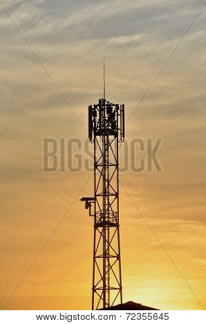 Silhouettes telecommunication tower in a wonderful orange.