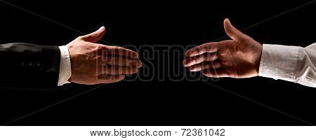 Two Men Reaching Out To Shake Hands