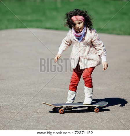 little girl with skateboard