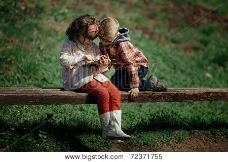 little girl and boy playing outdoor