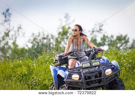 Elegant Woman Riding Extreme Quadrocycle