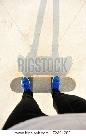 skateboarding legs at skatepark