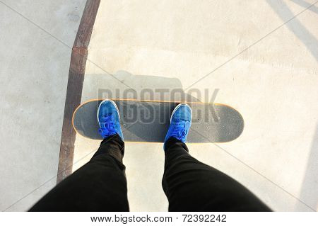skateboarding legs at skatepark