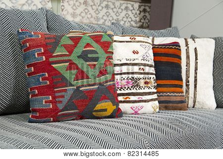 Herringbone sofa with traditional Turkish handmade colorful natural fabric pillows