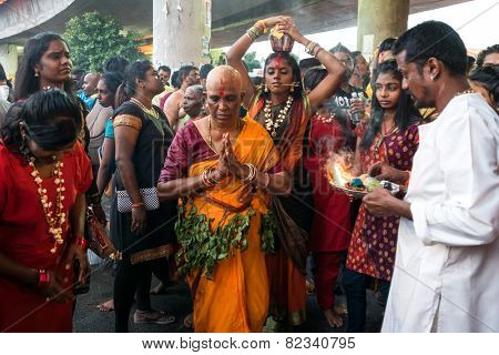 KUALA LUMPUR, MALAYSIA - FEBRUARY 3, 2015: Hindu devotees perform prayers at the Sri Mahamarriamman temple in Batu Caves. Hundreds of thousands of devotees come here for the Thaipusam prayers.