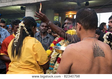 KUALA LUMPUR, MALAYSIA - FEBRUARY 3, 2015: Hindu devotees perform prayers at the Sri Mahamarriamman temple in Batu Caves. Hundreds of thousands of devotees come here for the Thaipusam prayers.