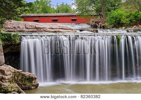 Waterfall And Red Covered Bridge