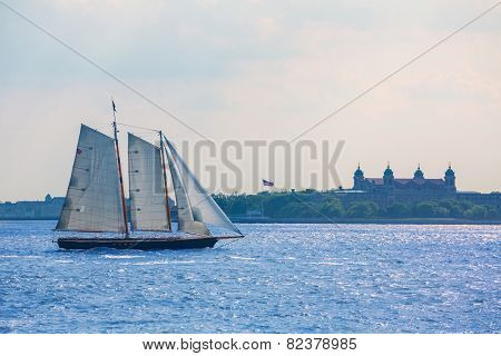 New York sailboat sunset and Ellis Island from Manhattan US