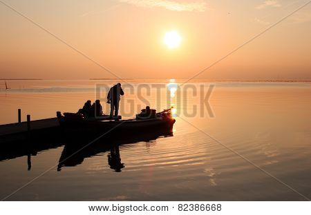tourists looking at the sunset