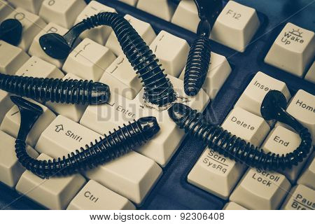 computer worm attacking computer system by penetrating a computer button on a keyboard - worm infection