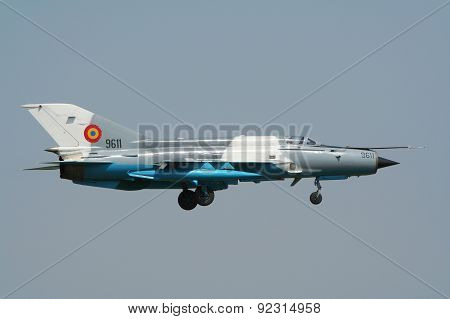 KECSKEMET HUNGARY - AUGUST 15 2008: Romanian Air Force MiG-21MF arriving for the Kecskemet Airshow. These old Mig's have been modernized between 1993 and 2002.