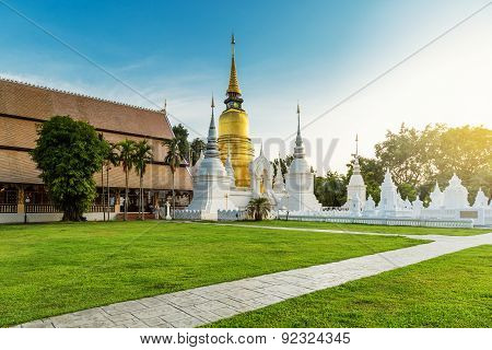 The Golden Pagoda At Wat Suan Dok, Chiangmai, Thailand, With Beautiful Blue Sky.