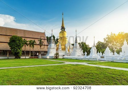 The Golden Pagoda At Wat Suan Dok, Chiangmai, Thailand, With Beautiful Blue Sky.