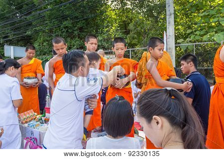 Many people give food and drink for alms to 1536 Buddhist monks in visakha bucha day