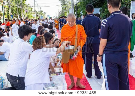 Many people give food and drink for alms to 1536 Buddhist monks in visakha bucha day