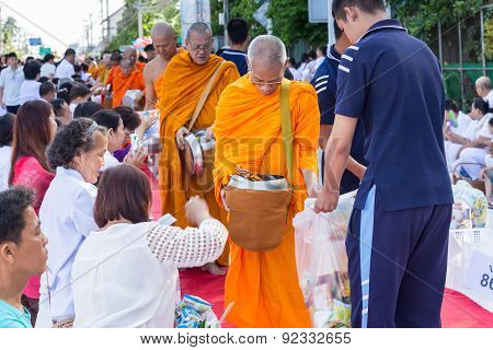 Many people give food and drink for alms to 1536 Buddhist monks in visakha bucha day
