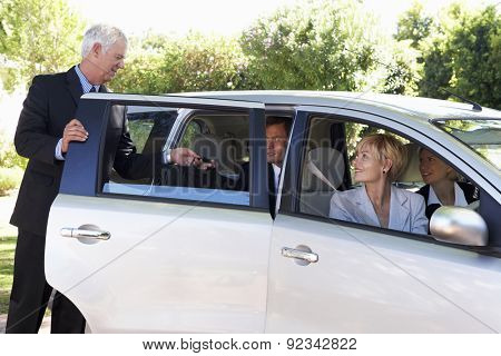 Group Of Business Colleagues Car Pooling Journey Into Work