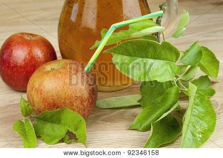 refreshing apple juice standing on a wooden table