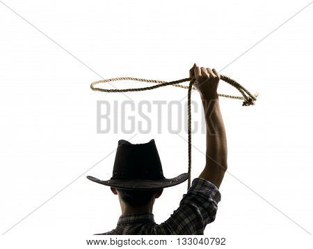 cowboy throws a lasso on the isolated background