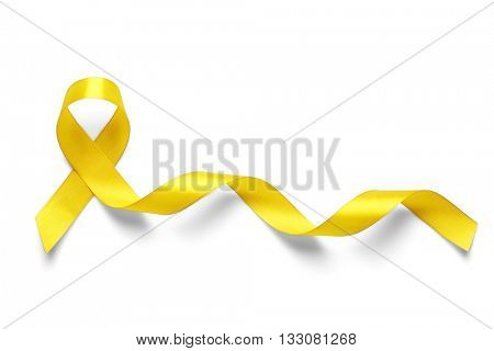 Yellow awareness ribbon on light background