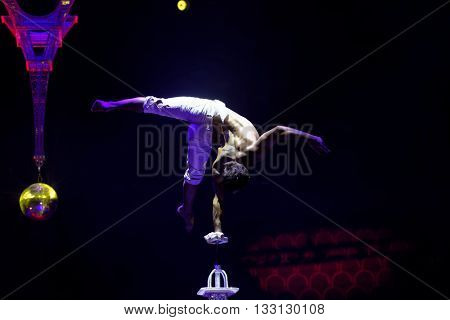 ST. PETERSBURG, RUSSIA - JUNE 2, 2016: Equilibrist Papin Khachatryan in the dress rehearsal of the Show of Water, Fire, And Light in the Ciniselli circus. This new show first time arrived in the city