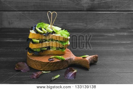High Large Layered Sandwich With Avocado
