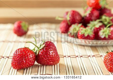 Fresh strawberry served on the wooden board