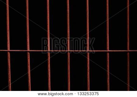 Close up of old rusty iron bar in jail.