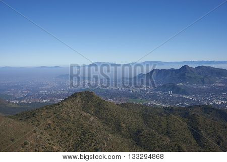 Panoramic view of Santiago, capital of Chile. Viewed from Parque Puente Nilhue in the foothills of the Andes Mountains looking towards Cerro Manquehue (1,635m).