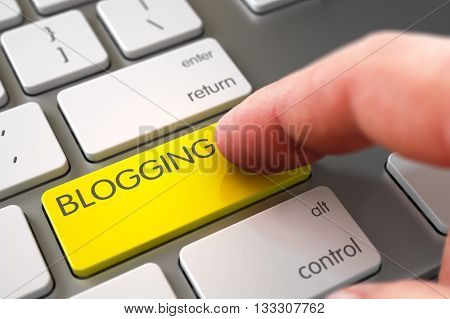 Man Finger Pressing Blogging Key on Laptop Keyboard. Blogging Concept - Metallic Keyboard with Key. Selective Focus on the Blogging Button. 3D Render.