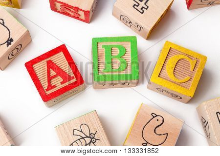 Abc Playing Cubes Arranged Over White Background