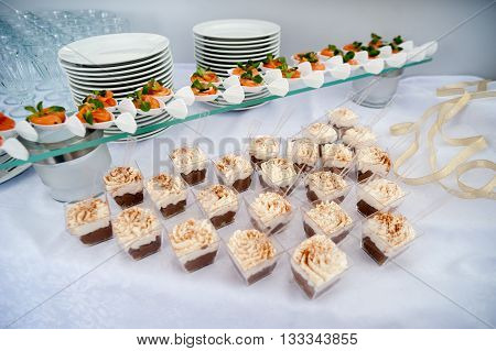beautiful candy bar serving a festive table with cupcakes towers and sweet love sign